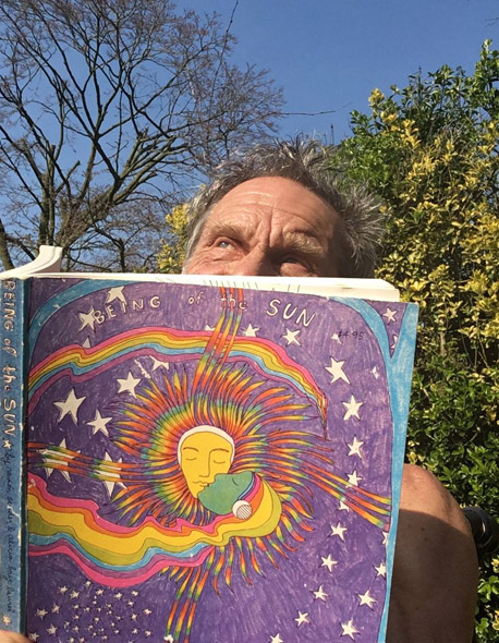Gregory Sams sungazing behind his copy of BOTS 2017