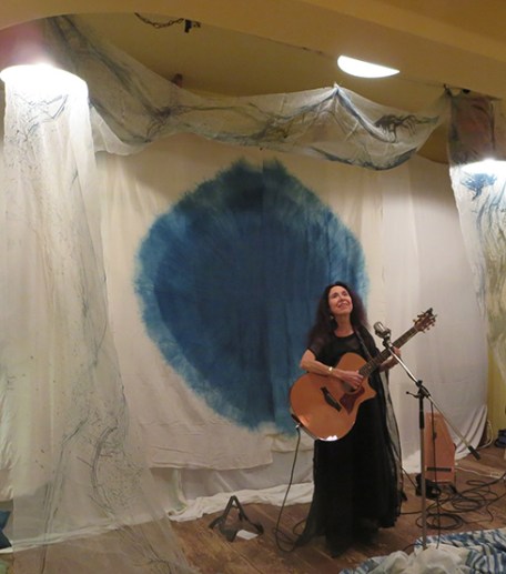 10-14-19-Japan-Kobe-Modernark-Alicia on stage w guitar modeling Little Eagle dress